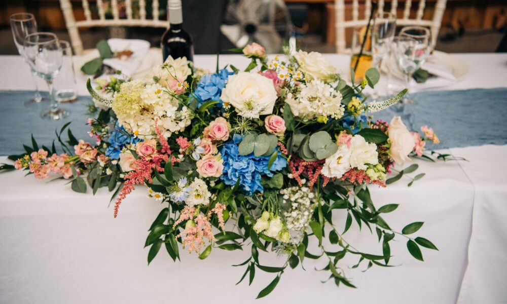 Flowers on the table at Waterside Country Barn, a Somerset wedding venue