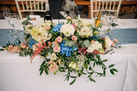 Flowers on the table at Waterside Country Barn, a Somerset wedding venue